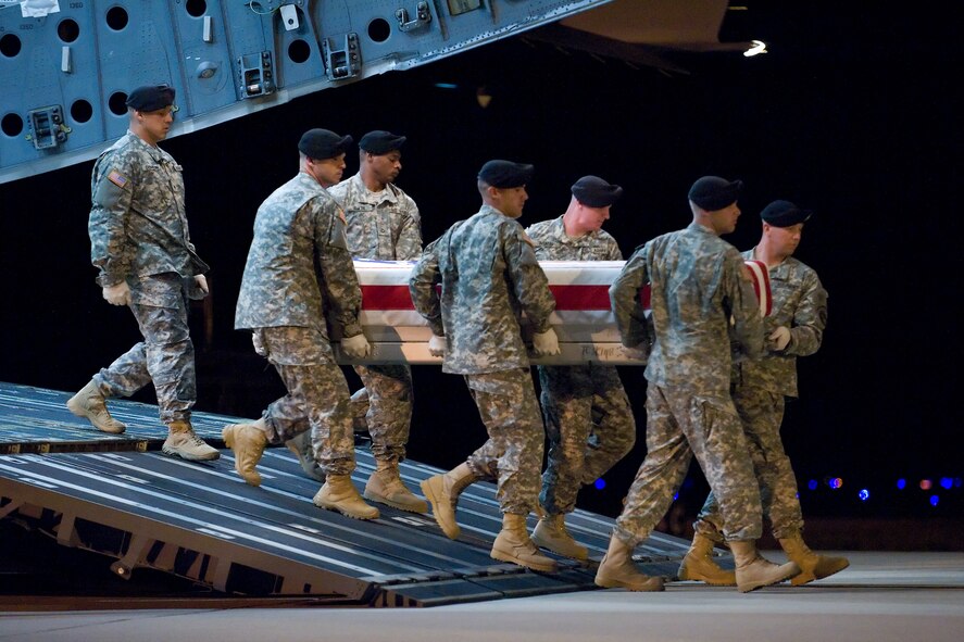 A U.S. Army carry team transfers the remains of Army Sgt. Anibal Santiago, of Belvidere, Ill., at Dover Air Force Base, Del., July 20. (U.S. Air Force photo/Roland Balik)