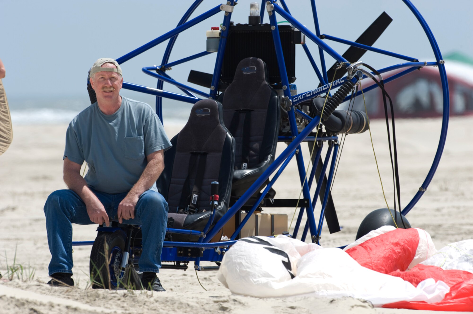 A Narrow Escape - Powered parachutist Ken Harger, 55, barely escaped with his life when his aircraft crashed into the Gulf of Mexico, trapping him under water for more than five minutes. He still flies his contraption, but says he is no longer quite as daring as he'd been before the mishap. (photo by Tech. Sgt. Samuel Bendet)
