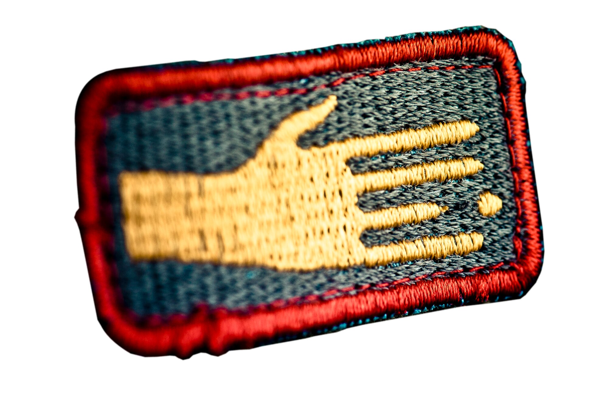 OFF BY A DIGIT - (Moral patch) Major Sang Kim, commanded UNAMID mission in Rwanda successfully but lost a finger over it. (Photo by TSgt Samuel Bendet)