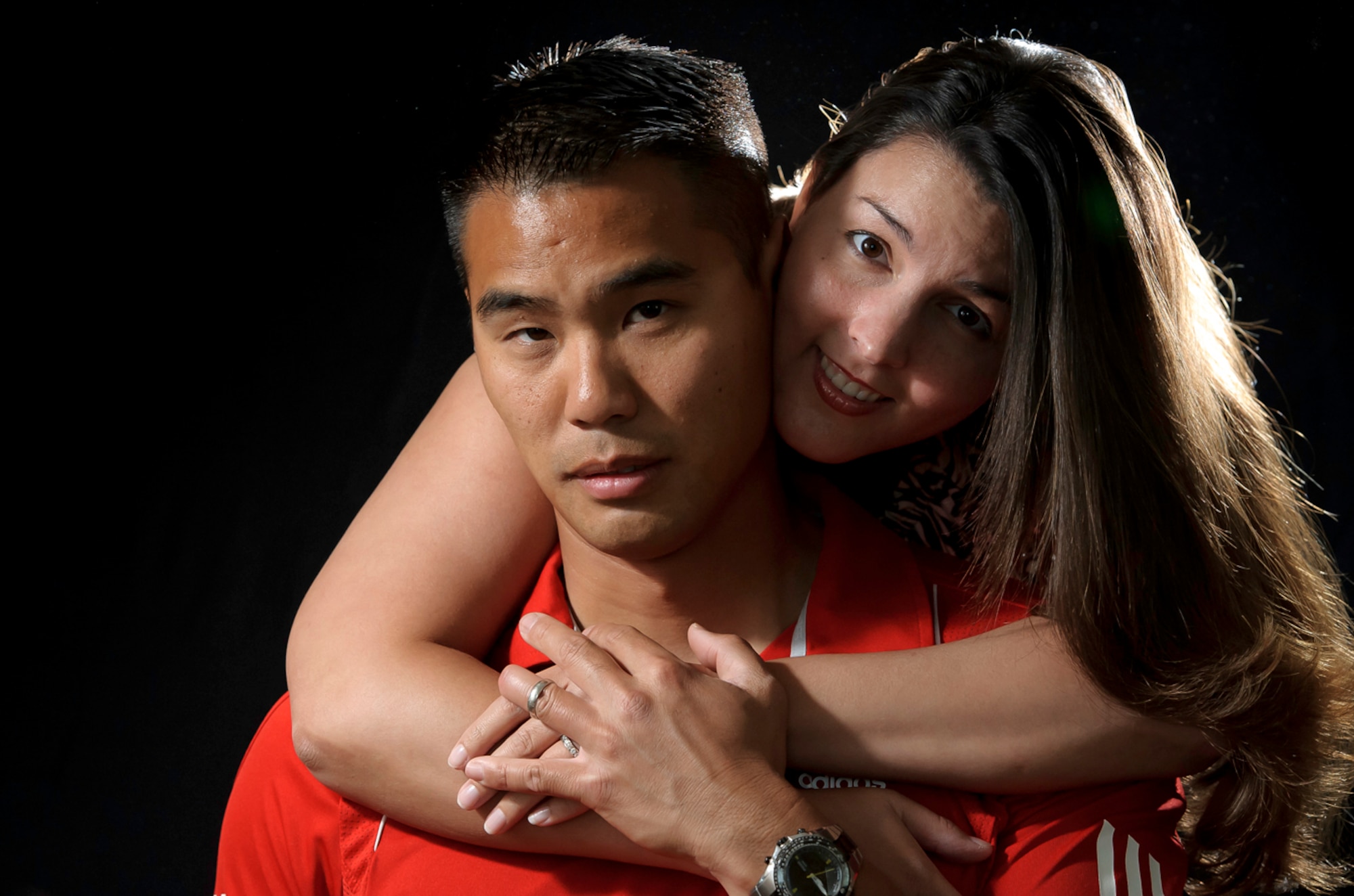 OFF BY A DIGIT - After celebrating their 10th anniversary April 29, Sang and Megan Kim say they don't need to wear their wedding rings to show their love and commitment to each other. "He can still wear a ring on his finger, but we are both leery of the danger since he works on the flight line. So most of the time he goes without it." (Photo by TSgt Samuel Bendet)