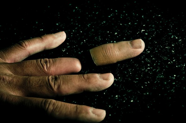 OFF BY A DIGIT - While he sometimes uses a prosthetic on the ring finger he severed while on a mission in Rwanda, Maj. Sang Kim said he prefers not to use the fake appendage. (Photo by TSgt Samuel Bendet)