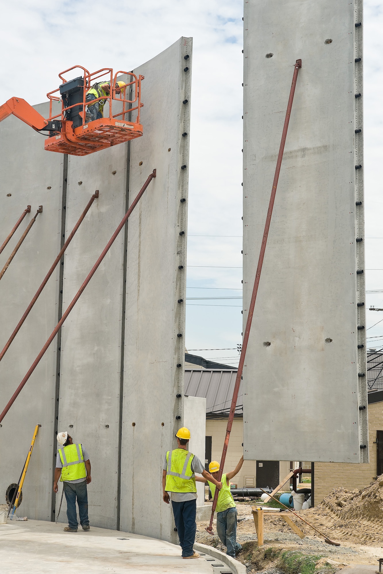 Workers maneuver a partition of the one-million gallon water tank being constructed at Dover Air Force Base, Del., June 29, 2010. The project cost approximately $1.6 million and replaced both the ground water tank and pump system for the Dover Air Force Base water system, which supplies water to the base from wells located on base. (U.S. Air Force photo by Roland Balik/Released)