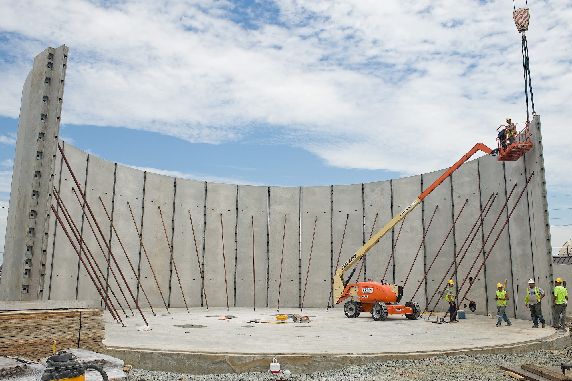 Workers secure a partition of the one-million gallon water tank being constructed at Dover Air Force Base, Del., June 29, 2010. The water tank was built to replace the old tank which had been constructed in the 1950s. (U.S. Air Force photo by Roland Balik/Released)