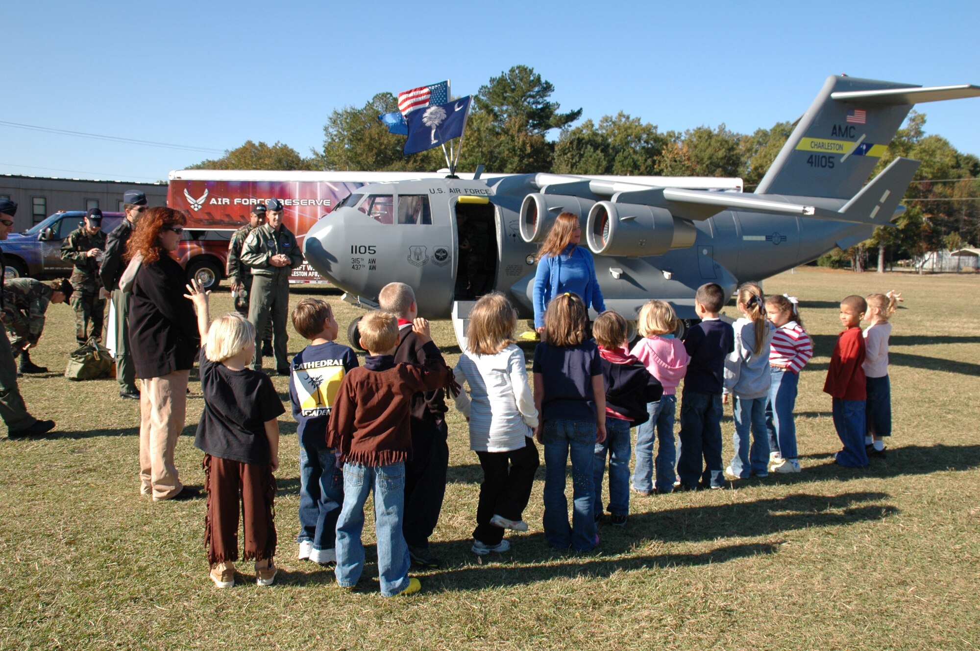 Mrs. Debbie Baldwin talks to a group of children about the Mini C-17 at Charleston Air Force Base, S.C. (U.S. Air Force photo)