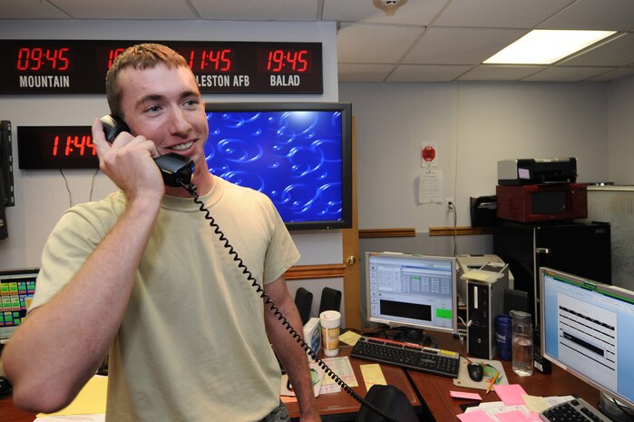 Senior Airman Samuel Siewert receives a congratulatory phone call from Gen. Raymond Johns July 27, 2010, at Joint Base Charleston, S.C., informing him he was selected from nominees across the entire Air Force as one of the 12 Outstanding Airmen of the Year. Airman Siewert was declared the number one life-saver out of 50 candidates and earned an advance Personal Protective Equipment Officer Designator and Breathing Apparatus Technician certification. Airman Siewert volunteered for Habitat for Humanity, the civil engineer haunted house, blood drive and provided briefings on fire education at Joint Base Charleston?s Child Development Center. General Johns is the commander of Air Mobility Command, and Airman Siewert is a 628th Civil Engineer Squadron fire protection journeyman. (U.S. Air Force photo/James M. Bowman)