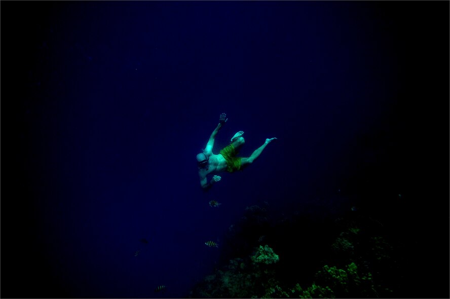 U.S. Naval Cmdr. Chad Reed from the Test and Evaluation Squadron Patuxent
River Naval Air Station, Md., dives down to explore the outer reef at White
Sands beach in the Gulf of Aden on June 1, 2008 during a Morale and
Recreation trip while deployed to Combined Joint Force- Horn of Africa
located at Camp Lemonier, Djibouti. (photo by Master Sgt. Jeremy T. Lock)