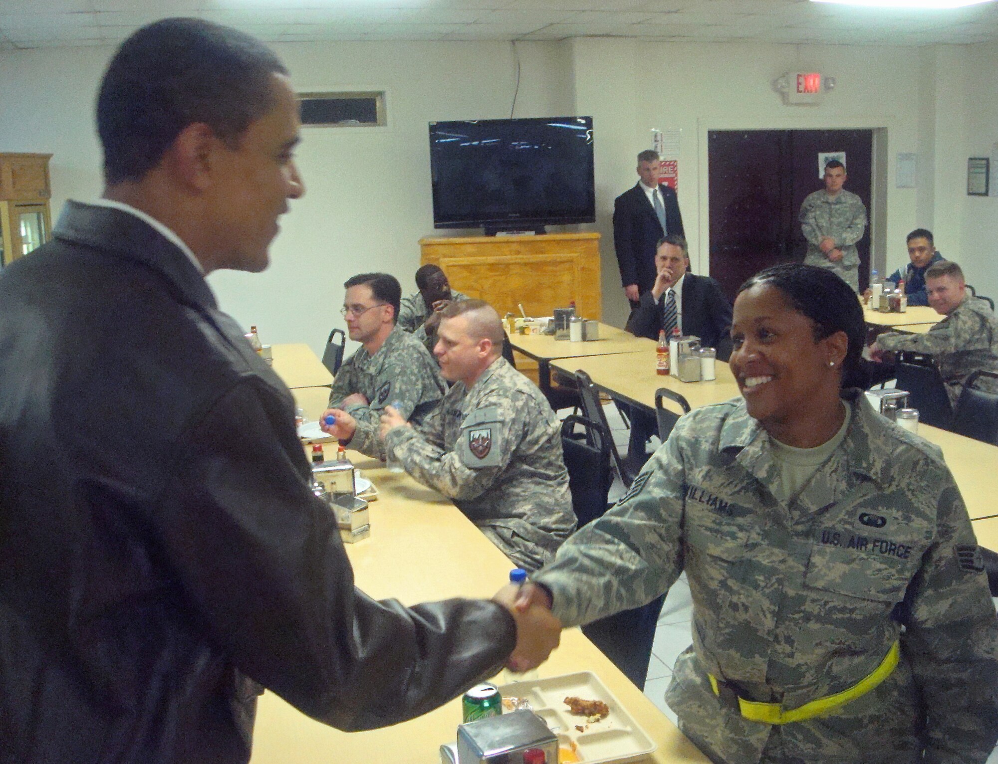 TRAVIS AIR FORCE BASE, Calif. -- An Airman from Team Travis had the rare privilege of meeting our Commander-in-Chief during her recent deployment to Afghanistan. Staff Sgt. Danielle Williams, a chaplain assistant assigned to the 349th Air Mobility Wing, shakes hands with President Barack Obama during a meal break at her deployed location. A traditional reservist, Sergeant Williams is employed by the California Franchise Tax Board. (U.S. Air Force photo)