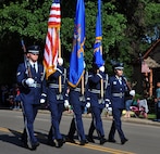 MINOT, N.D. -- Members of the Minot Air Force Base honor guard march in a formation during the North Dakota State Fair parade here July 24. The 2010 North Dakota State Fair is open to the public until July 31. (U.S. Air Force photo by Senior Airman Michael J. Veloz)