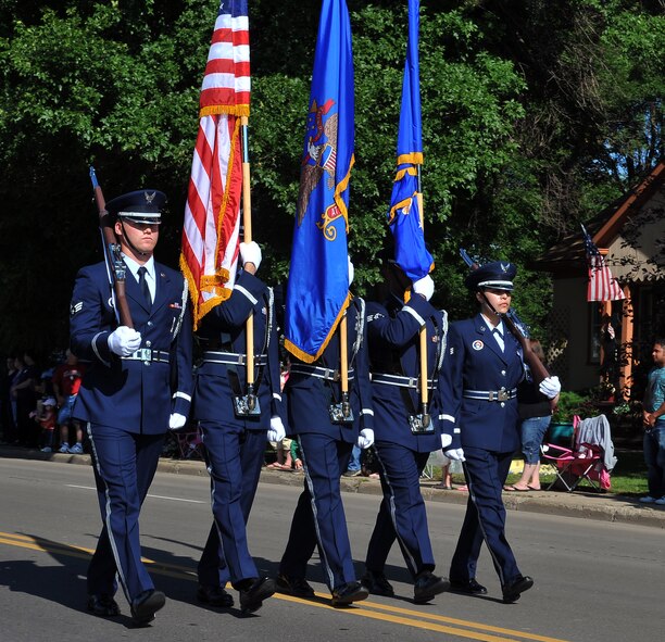MINOT, N.D. -- Members of the Minot Air Force Base honor guard march in a formation during the North Dakota State Fair parade here July 24. The 2010 North Dakota State Fair is open to the public until July 31. (U.S. Air Force photo by Senior Airman Michael J. Veloz)