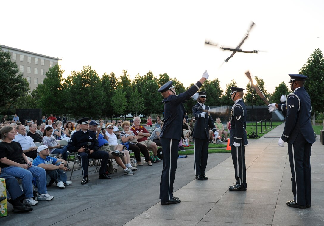 The U.S. Air Force Honor Guard Drill Team performs July 21 at the Air Force Memorial in Washington. The show also included a performance by The U.S. Air Force Band Max Impact and an integrated musical and drill performance by Air Strike. The Band’s six performing ensembles take turns performing throughout the summer at the Air Force Memorial each Wednesday and Friday with no fee for attendance. The ensembles also take turns performing every Tuesday on the steps of the Capitol Building. For more information, please visit www.usafband.af.mil. (U.S. Air Force photo by Senior Airman Jaclyn McDonald)