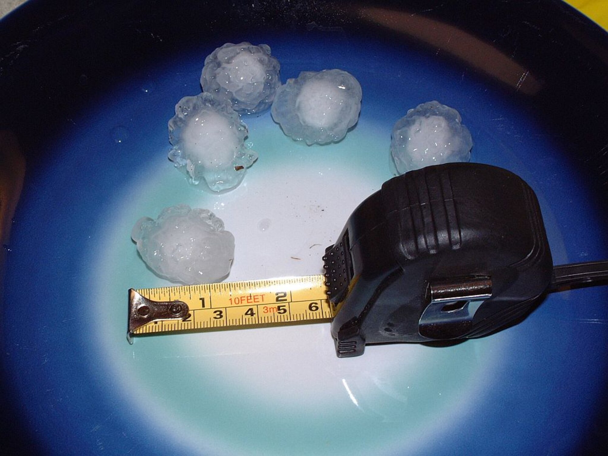 MINOT AIR FORCE BASE, N.D. – A large piece of hail from an evening thunderstorm is shown here July 26. Some hail from the storm measured up to 1 ¼ inches. (Courtesy photo by Master Sgt. Jeff Godemann)