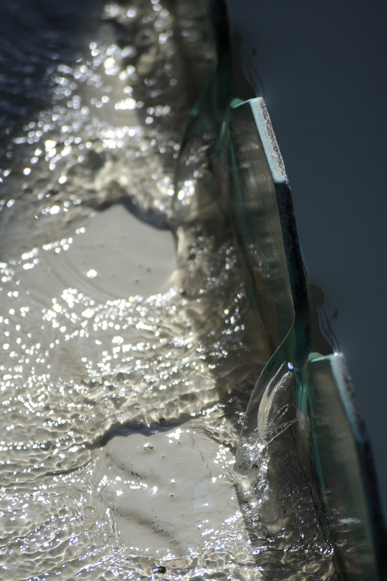 WHITEMAN AIR FORCE BASE, Mo. - The clarity filter allows sludge to settle to the bottom of the tank while the clear water trickles out the sides and on to the next process.(U.S. Air Force photo by Senior Airman Carlin Leslie)
