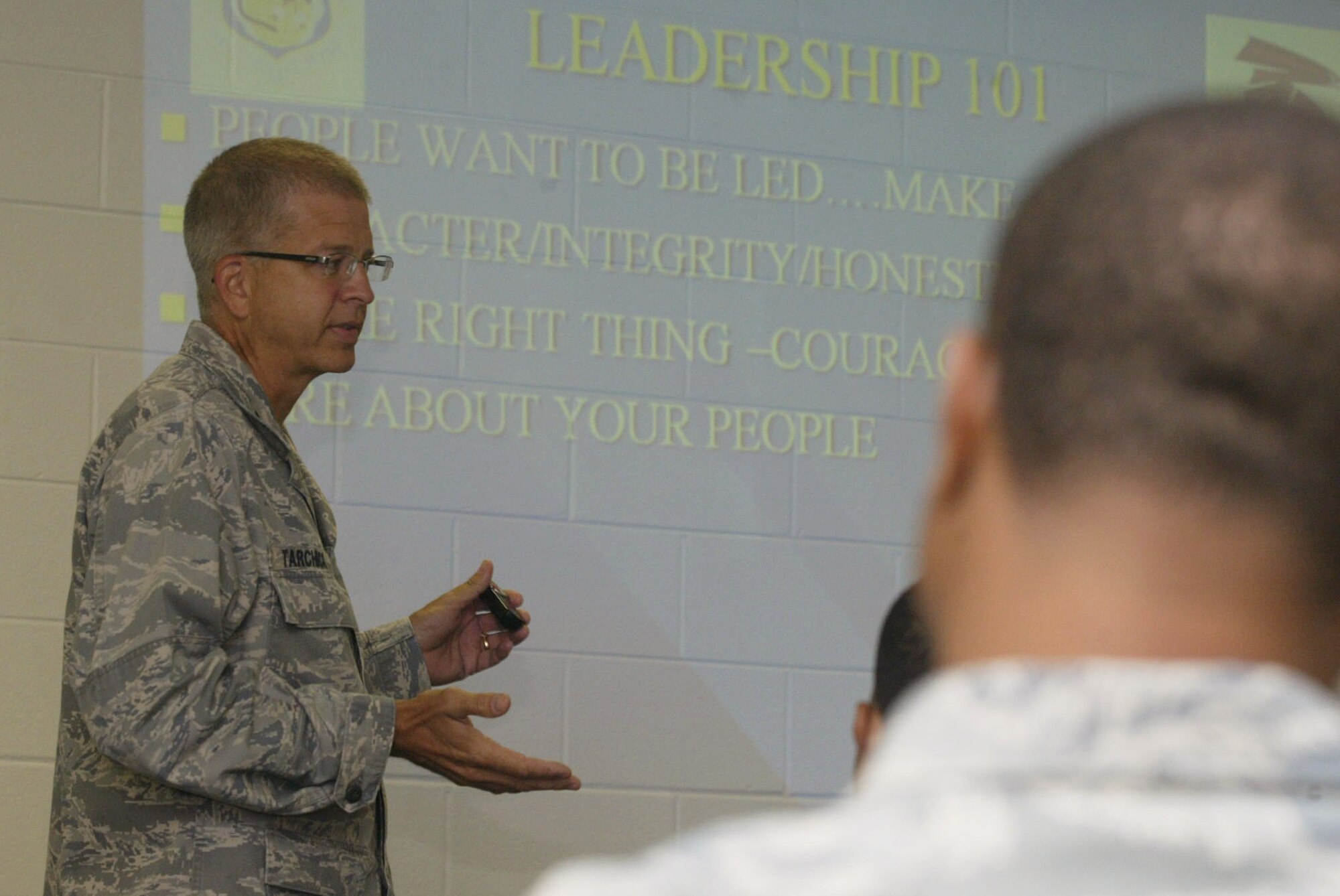 Col. Timothy E. Tarchick, Commander, 94th Airlift Wing speaks with students attending the Noncommissioned Officer Leadership and Development Course  about traits of a leader in his "Leadership 101" briefing here July 27. (U.S. Air Force Photo/Don Peek)