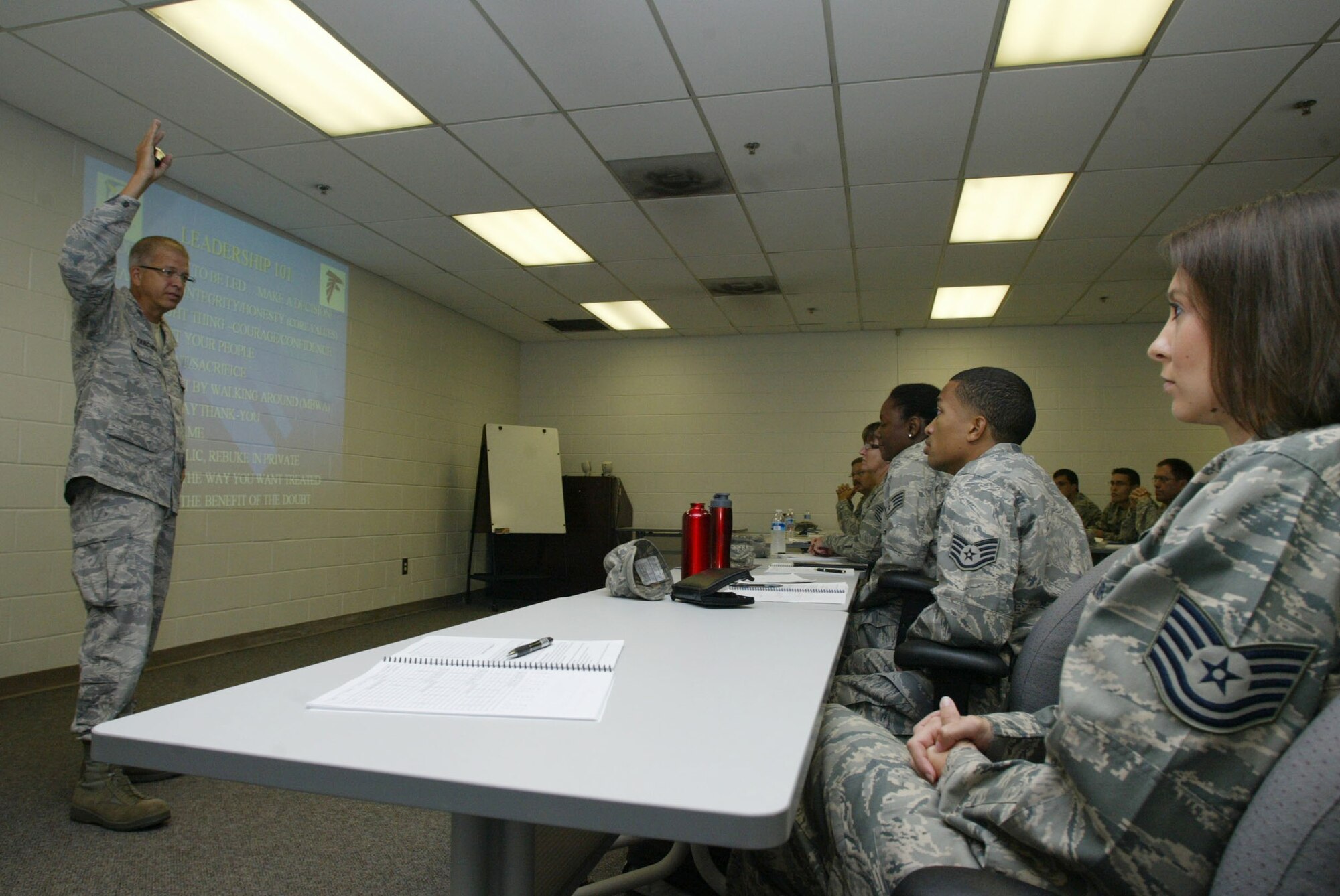 Col. Timothy E. Tarchick, Commander, 94th Airlift Wing speaks with students attending the Noncommissioned Officer Leadership and Development Course  about traits of a leader in his "Leadership 101" briefing here July 27. (U.S. Air Force Photo/Don Peek)