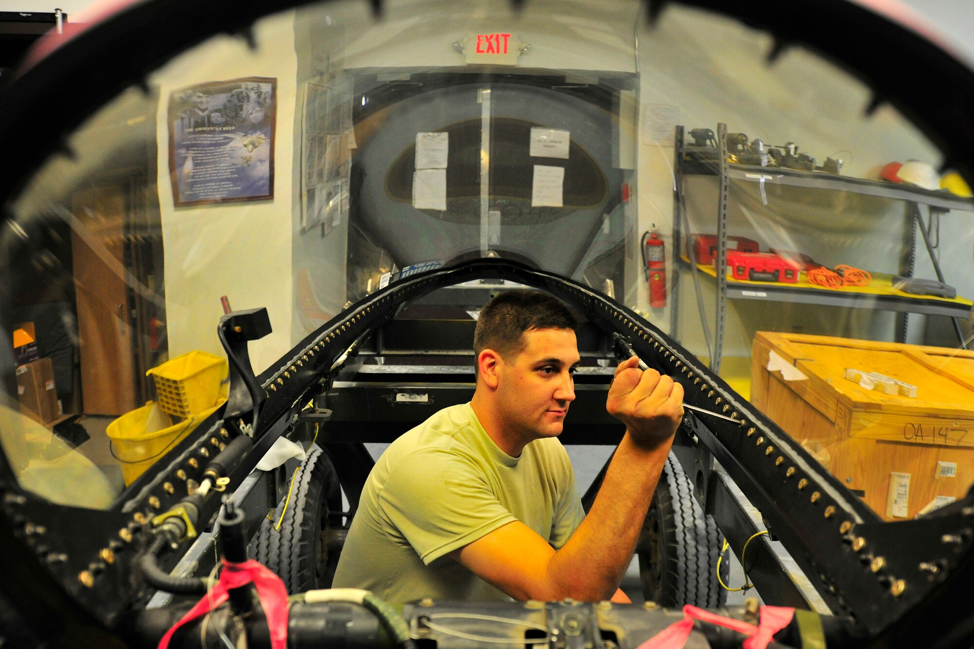 Senior Airman Michael Girard, an aircrew egress journeyman assigned to the 455th Expeditionary Maintenance Squadron, tests the bolt torque ratings on a new F-16C Fighting Falcon canopy at Bagram Airfield, Afghanistan, July 27, 2010. (U.S. Air Force photo/Staff Sgt. Christopher Boitz)