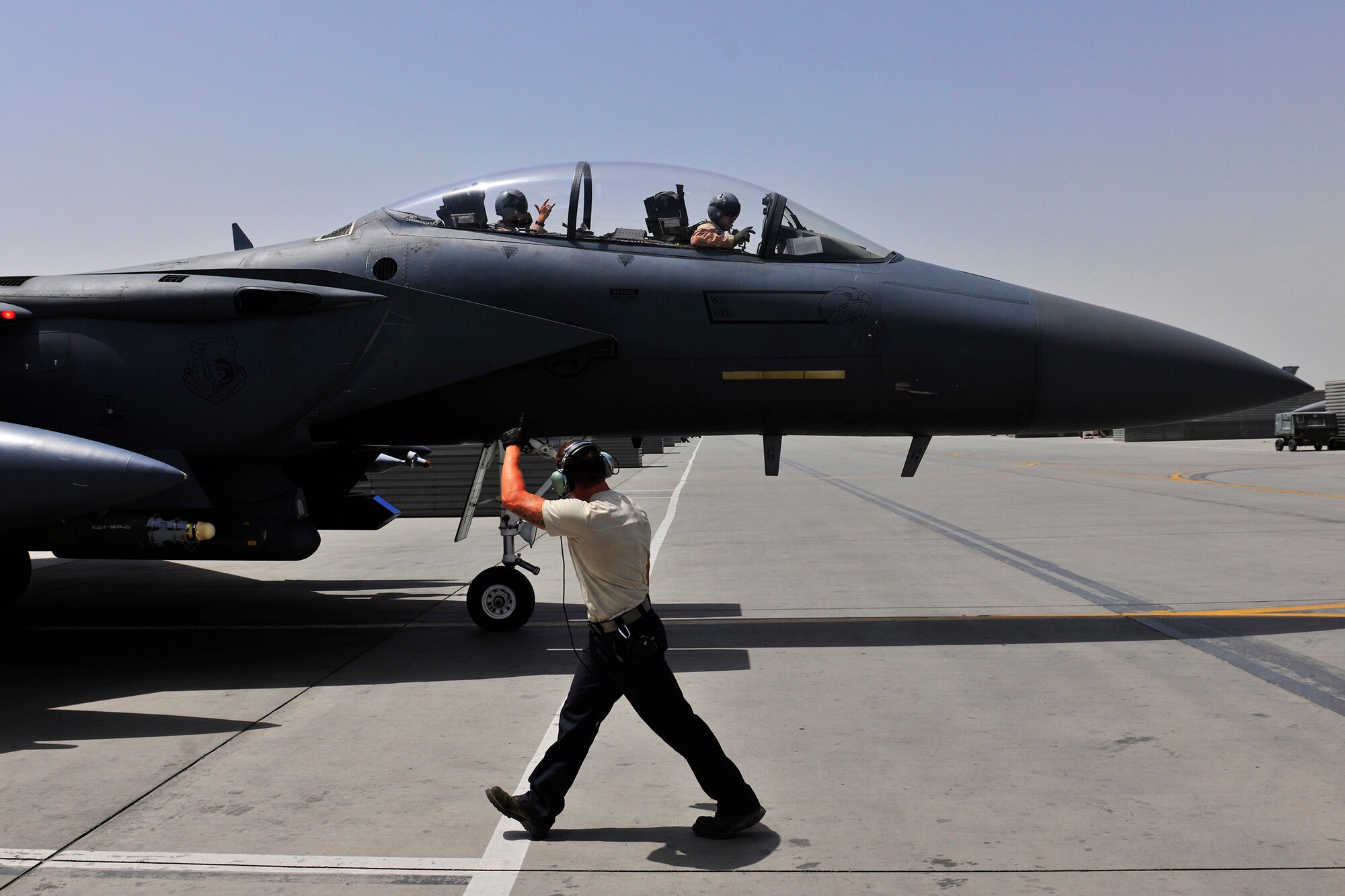 Senior Airman Donald Jenkins, a crew chief assigned to the 455th Expeditionary Aircraft Maintenance Squadron, launches an F-15E Strike Eagle at Bagram Airfield, Afghanistan, July 27, 2010. Airman Jenkins is a native of Riverside, Calif.  (U.S. Air Force photo/Staff Sgt. Christopher Boitz)