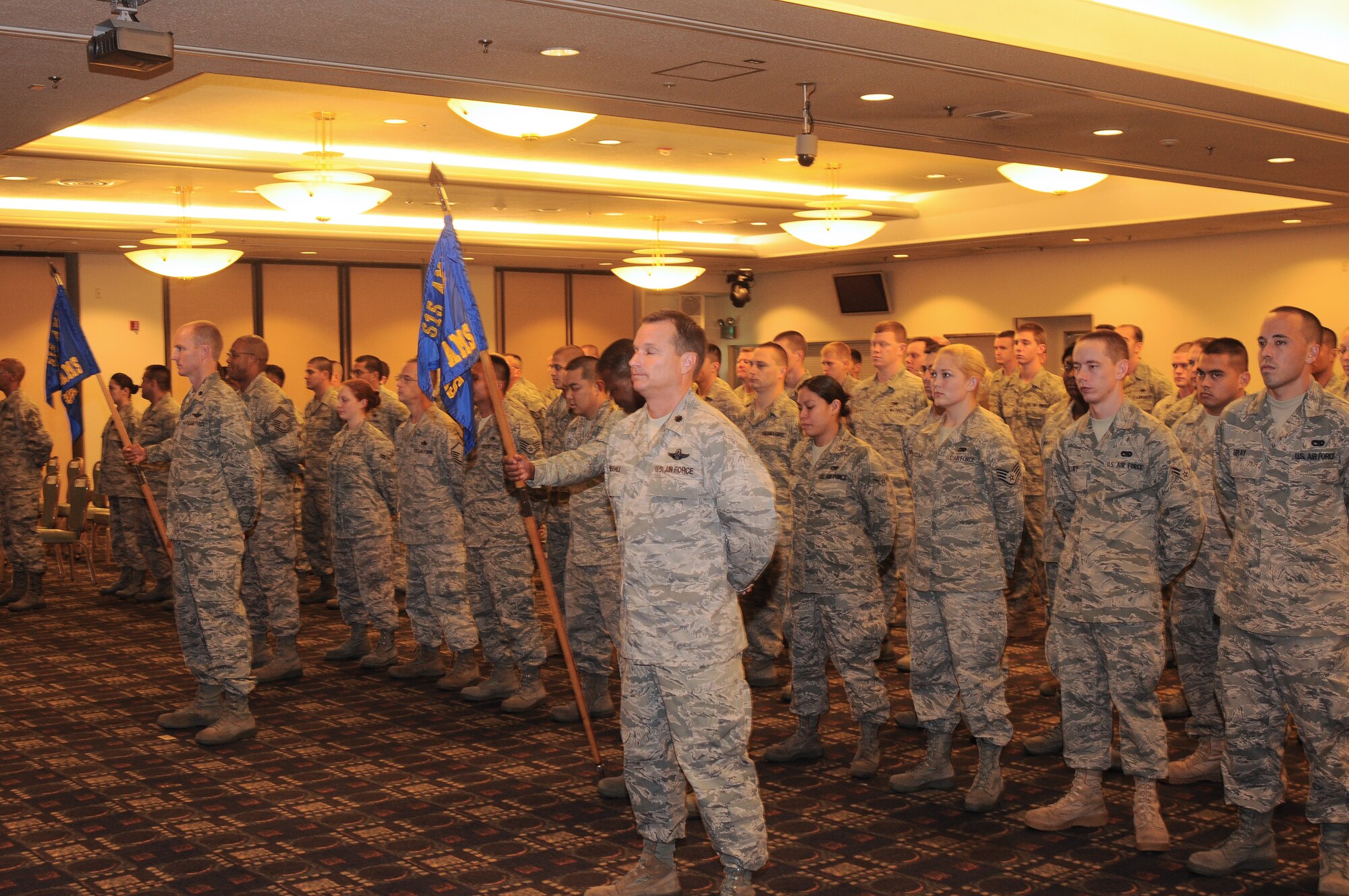 YOKOTA AIR BASE, Japan -- A formation consisting of members from the 515th Air Mobility Operations Group wait for the start of the 515th AMOG change of command to begin here July 13. Colonel Ricci replaced Col. Mark Baker as commander of the 515th AMOG. (U.S. Air Force photo/Katrina R. Menchaca)