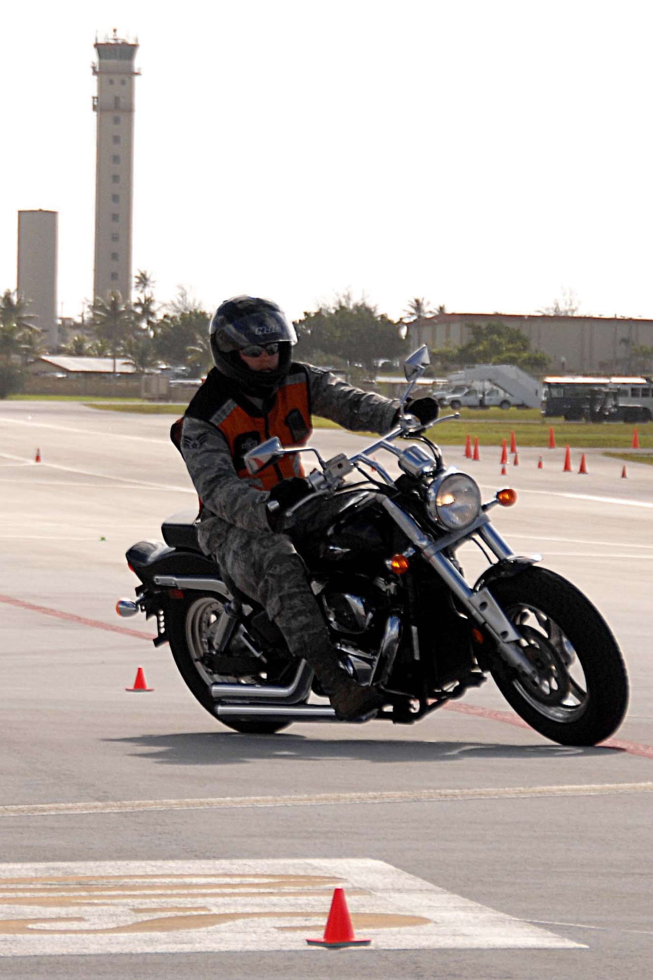 ANDERSEN AIR FORCE BASE, Guam -- A rider shows off what he learned during the Advanced Rider Track Day event on the Andersen flightline July 27. The 13th Air Force, 36th Wing and Joint Region Marianas safety offices worked together to bring the CSBS here to teach Guam motorcycle riders how to safely execute a turn at realistic speeds. (U.S. Air Force photo by Airman 1st Class Anthony Jennings)