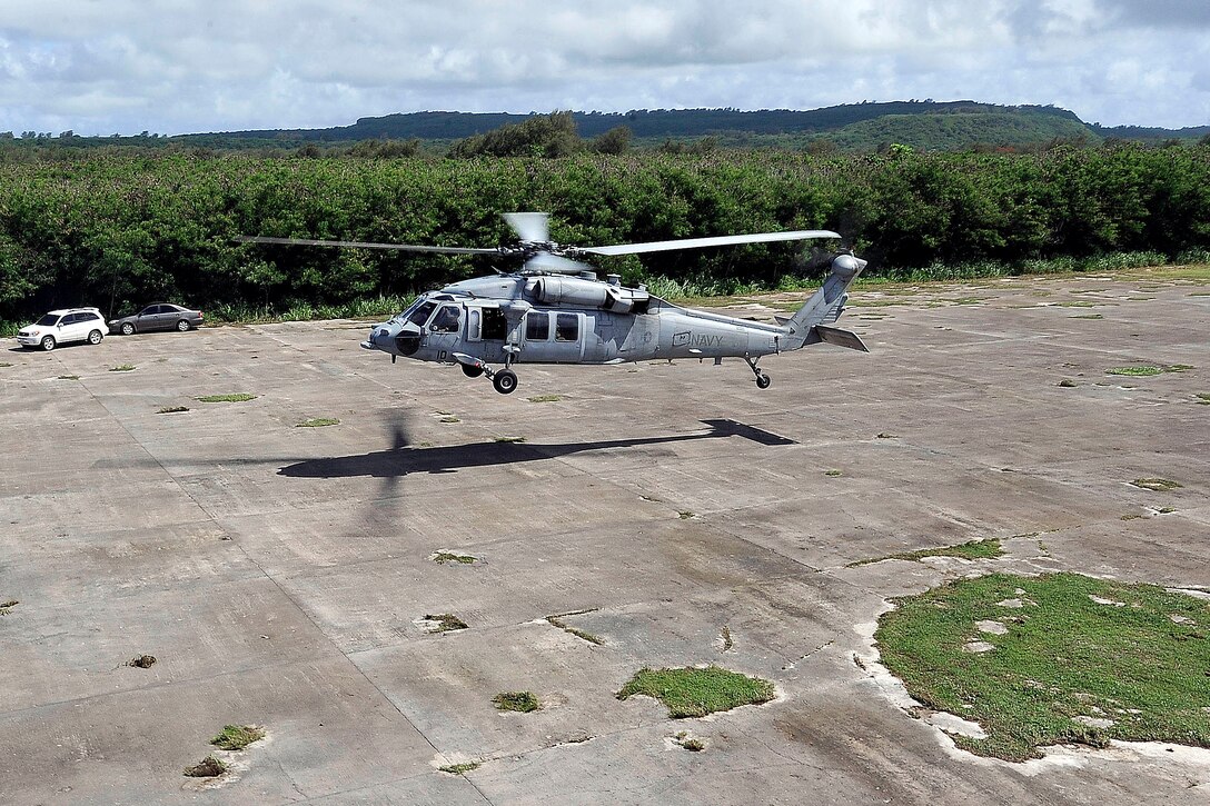 U.S. Deputy Defense Secretary  William J. Lynn III tours a bomb pit loading area where the Enola Gay aircraft was loaded with the atomic bomb used on Hiroshima, on the island of Tinian, July 28, 2010.
