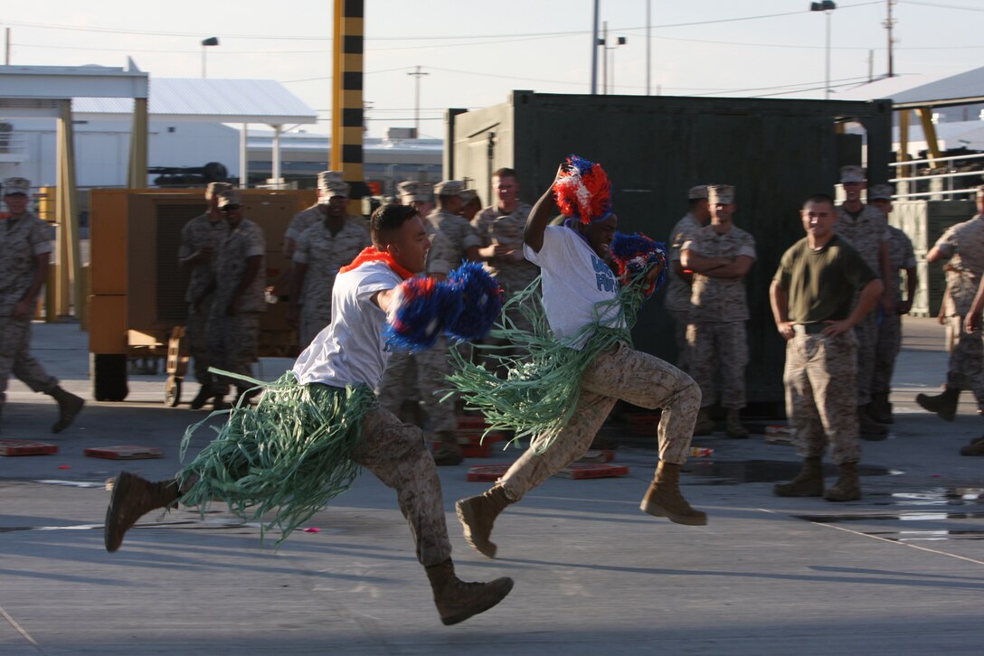 MARINE CORPS AIR GROUND COMBAT CENTER TWENTYNINE PALMS, Calif.--Marines from the 3rd Light Armored Calvary Battalion run a relay race which included putting a random clothing item on at different points of the race during a Barracks Bash July 29 at the 3rd LAR ramp.