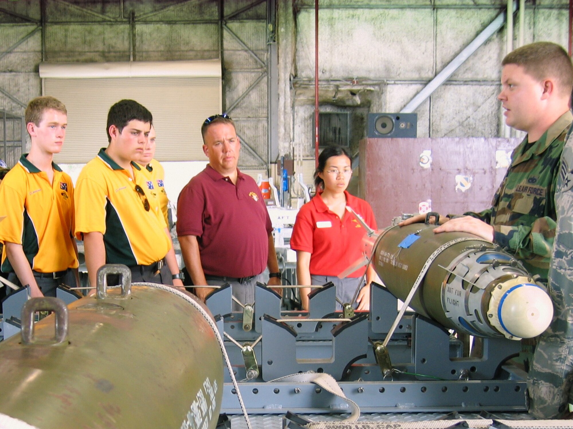 SEYMOUR JOHNSON AIR FORCE BASE, N.C. – Staff Sgt. Thomas Cunningham explains the capabilities of the GBU-12 bomb unit to members of the Civil Air Patrol International Air Cadet Exchange program during a base tour here July 29, 2010. The cadets from Australia and Canada participated in the tour with the Goldsboro CAP Composite Squadron Unit NC 126. Sergeant Cunningham is a 4th Maintenance Group load crew team chief. (U.S. Air Force photo/Robin Demark)