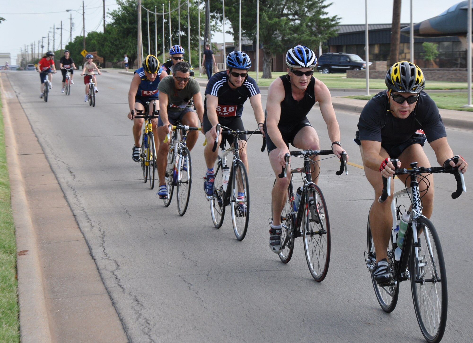 The leading group of cyclists head down the last straight of their third lap of the bike portion of the biathlon at Sheppard Air Force Base, Texas, July 24. More than 40 men, women and children participated in the biathlon, which consisted of a 20K bike Ride and a 5K run. The winners were selected based on the three fastest times in the categories of men 40 and over, men 39 and under, women 39 and under, youth boys 16 and under and youth girls 16 and under. (U.S. Air Force photo/Airman 1st Class Adawn Kelsey) 