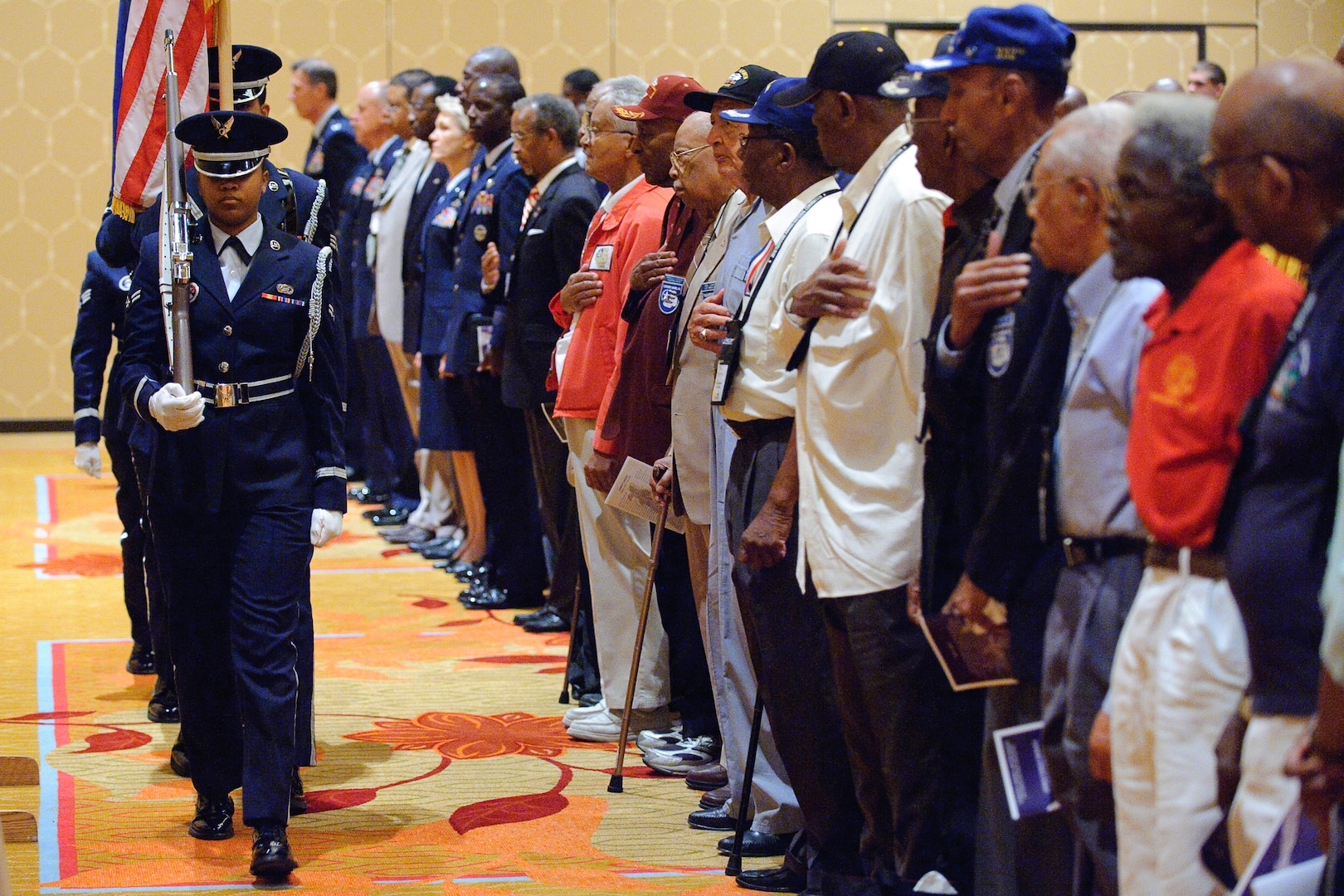 Members of the Randolph Honor Guard post the colors at the beginning of the 39th Tuskegee Airmen convention, held in downtown San Antonio, Texas.  Tuskegee Airmen honor the flag prior to the Lonely Eagles Ceremony July 29.  The ceremony recognizes Tuskegee Airmen who died during the past year. (U.S. Air Force photo/Steve Thurow)