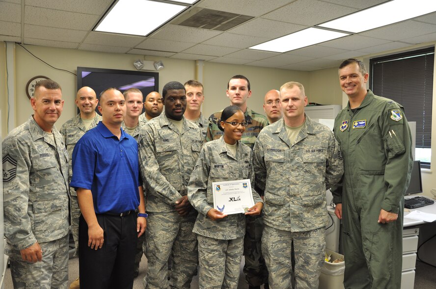LAUGHLIN AIR FORCE BASE, Texas – Airman 1st Class Ashalay Martin, 47th Communications Squadron, is presented the XLer of the Week award by Col. Craig Wills, 47th Operations Group commander, July 28. The XLer is a weekly award chosen by 47th FTW leadership and given to individuals who consistently make outstanding contributions to Laughlin and their unit. (U.S. Air Force photo by Staff Sgt. Desiree Economides)