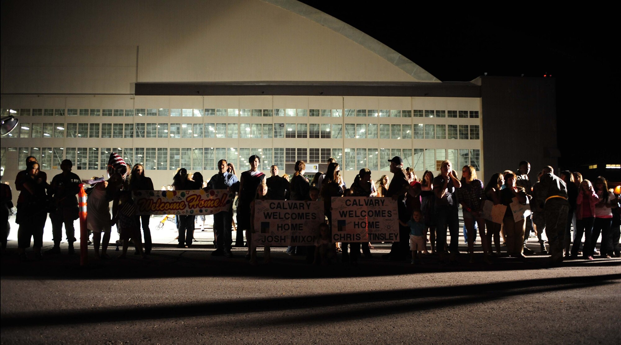 ELLSWORTH AIR FORCE BASE, S.D. – Friends and family members of deployed Airmen stand outside the PRIDE Hangar before the Airmen step off the plane, July 28. More than 350 Airmen from the 34th Bomb Squadron, 28th Aircraft Maintenance Squadron, Munitions Squadron, Operational Support Squadron, Logistics Readiness Squadron and Maintenance Squadron returned home after a six-month deployment to Southwest Asia in support of Operations Iraqi and Enduring Freedom. (U.S. Air Force photo/Airman 1st Class Corey Hook)