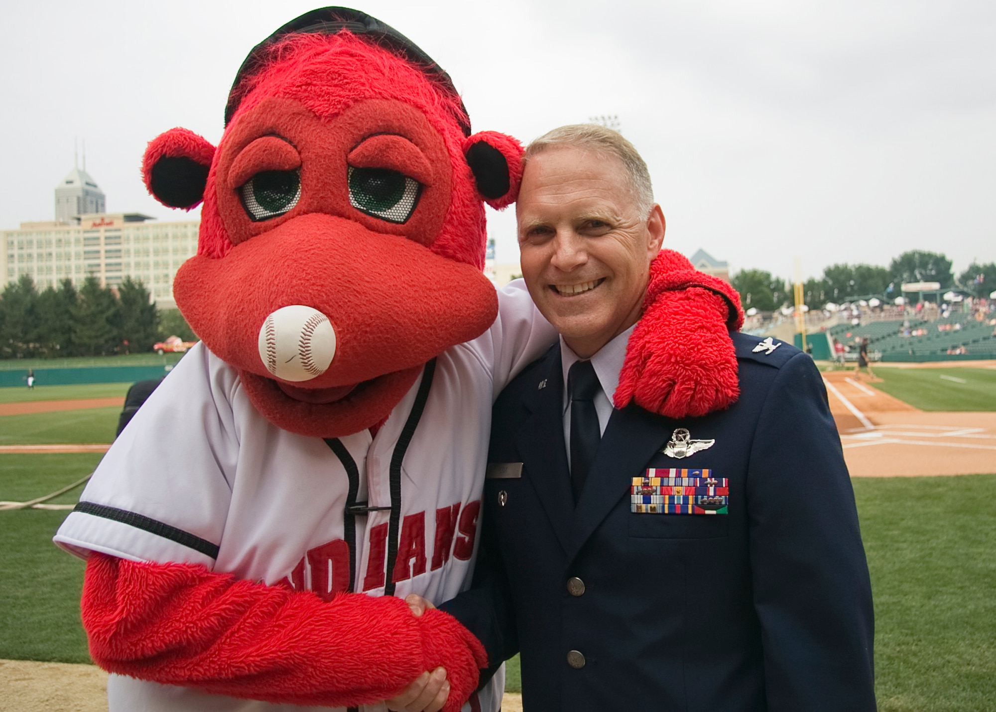 GRISSOM AIR RESERVE BASE, Ind. -- Col. Tim Cox, 434th Air Refueling Wing vice commander, poses for a photo with Rowdie, the Indianapolis Indians mascot, before a recent baseball game. Colonel Cox and other members of the 434th Air Refueling Wing took part in pre-game ceremonies. (U.S. Air Force photo/Tech. Sgt. Mark R. W. Orders-Woempner)
