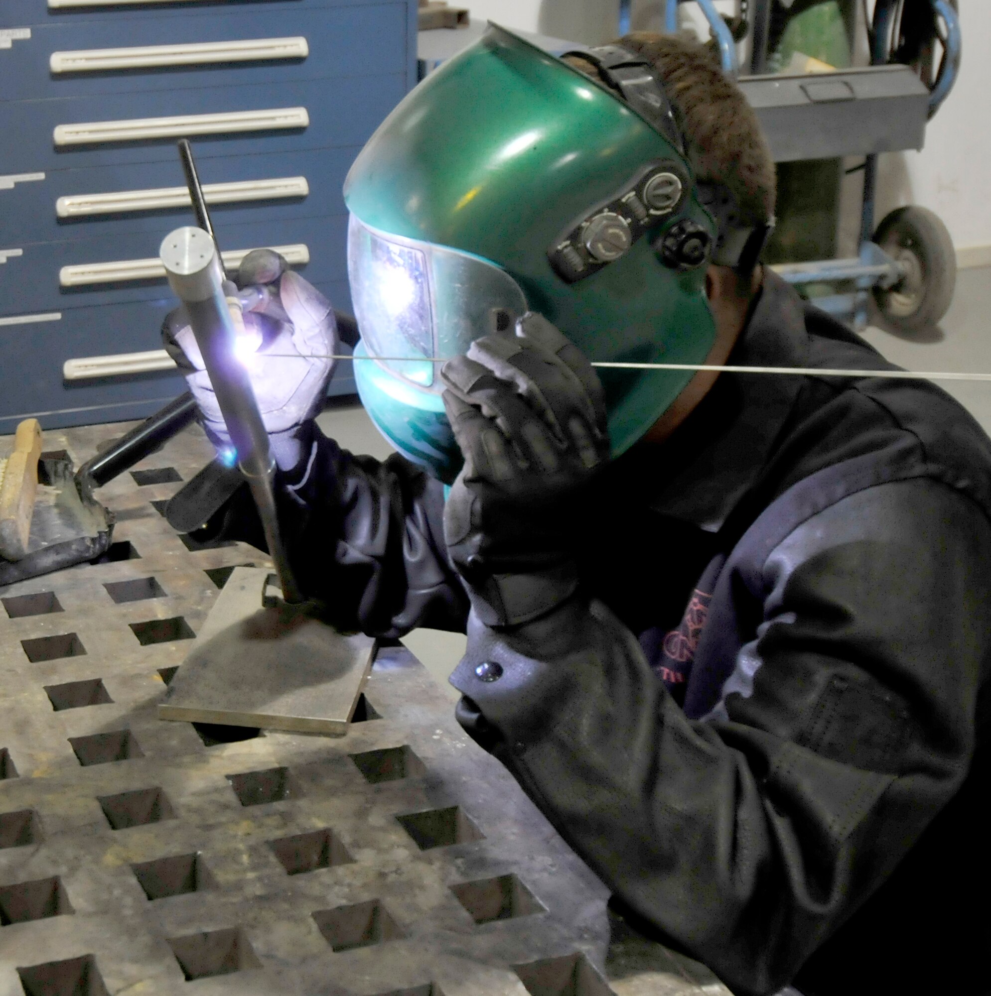 Senior Airman Lloyd Davis welds a titanium certification tube for practice July 21, 2010, at Joint Base Balad, Iraq. Airman Davis is a 332nd Maintenance Squadron metals technology journeyman. (U.S. Air Force photo/ Staff Sgt. Phillip Butterfield)