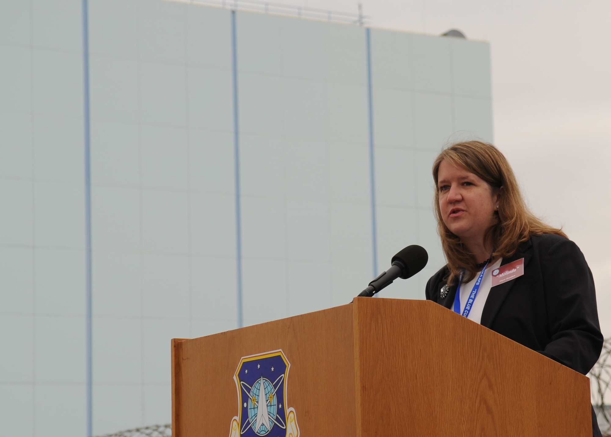 SUNNYVALE, Calif.-- Mayor Melinda Hamilton delivers a speech during the Onizuka Air Force Station closure ceremony here July 28, 2010. Built in 1960, Onizuka AFS was originally known as the Air Force Satellite Test Center. It was selected for closure by the Base Closure and Realignment Commission in 2005, with the recommendation to move operations to Vandenberg Air Force Base, in order to consolidate satellite command and control operations while reducing excess infrastructure.  (U.S. Air Force Photo/Senior Airman Bryan Boyette)
