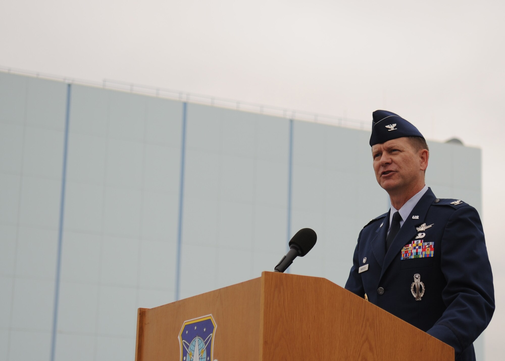 SUNNYVALE, Calif.-- Col. Wayne Monteith, the 50th Space Wing commander, delivers a speech during the closure ceremony of Onizuka Air Force Station here, Wednesday, July 28, 2010. Built in 1960, Onizuka AFS was originally known as the Air Force Satellite Test Center. It was selected for closure by the Base Closure and Realignment Commission in 2005, with the recommendation to move operations to Vandenberg Air Force Base, in order to consolidate satellite command and control operations while reducing excess infrastructure. (U.S. Air Force Photo/Senior Airman Bryan Boyette)