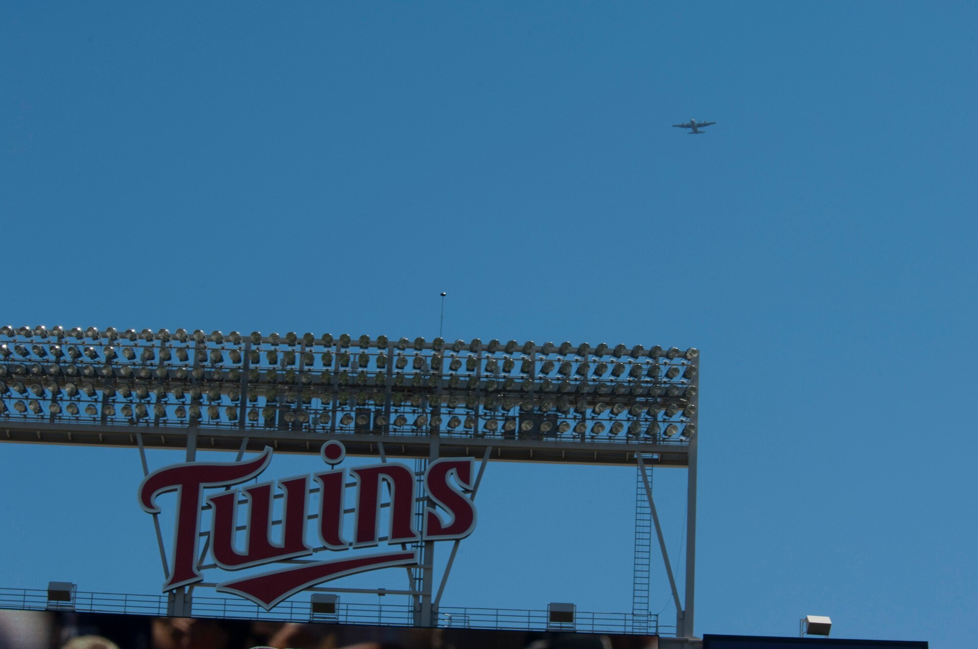 A C-130 "Hercules" from the 133rd Airlift Wing, Minnesota Air National Guard flies over Target Field and downtown Minneapolis on July 21, 2010, preparing to drop members of the U. S. Navy parachute team "Leap Frogs" at the beginning of a Minnesota Twins game. The Minnesota Twins are celebrating Navy Day in their new stadium. The Air National Guard crew is joined by aviators from the 934th Airlift Wing, U. S. Air Force Reserve supporting this event.  USAF official photo by Senior Master Sgt. Mark Moss