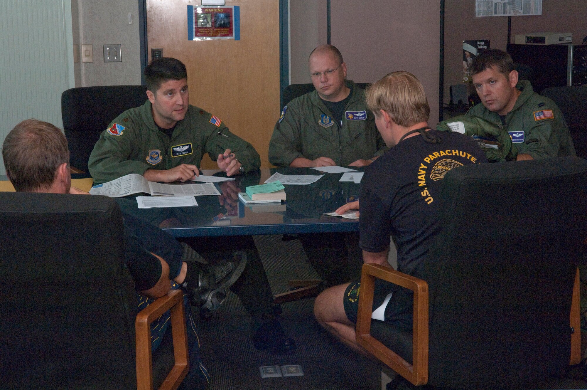 C-130 air crew members from the 133rd Airlift Wing, Minnesota Air National Guard are joined by aviators from the 934th Airlift Wing, U.S. Air Force Reserve to fly missions supporting the U. S. Navy parachute team, participating with Minnesota baseball teams and celebrating the relationship amongst the military organizations, the St. Paul Saints, and the Minnesota Twins. On July 20, 2010 at the St. Paul Air National Guard Base, the flyers plan their mission with the parachute team, where the Navy "Leap Frogs" were dropped from the Minnesota Air Guard C-130 to glide into Midway Field at the opening of a Saints game. USAF official photo by Senior Master Sgt. Mark Moss