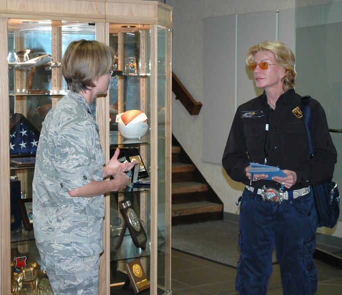 Patricia Cornwell and Col. Stacy L. Yike, 66th Air Base Group commander, discuss the base's mission in the Electronic Systems Center headquarters lobby on July 26. (U.S. Air Force photo by Sarah Olaciregui) 
