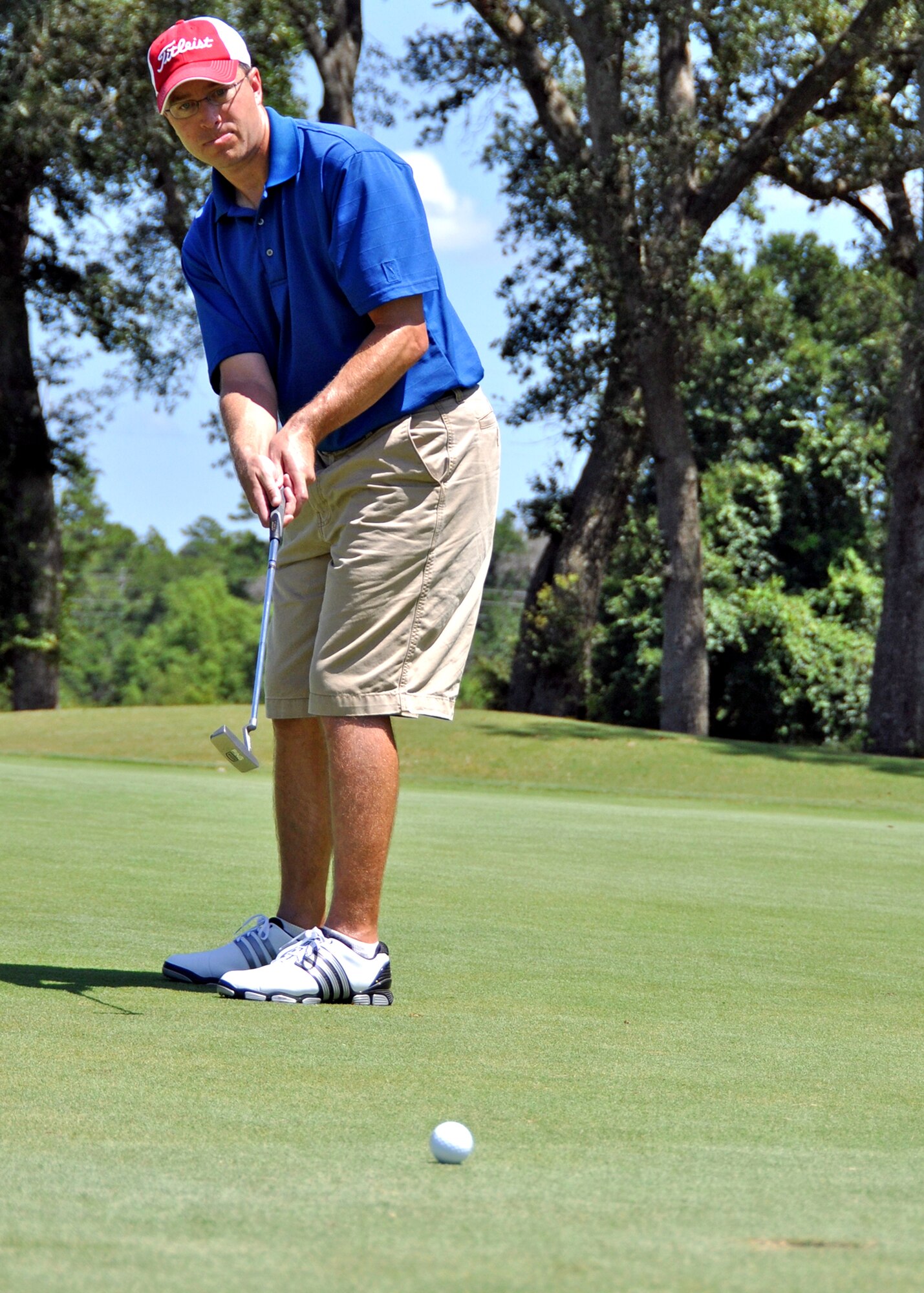 Jeff Kile, 53rd Wing, tries to sink a putt on a Par 3 during the base intramural golf championship July 28 at the Eglin golf course.  Perennial rivals, 53rd Wing and Air Force Research Lab, faced off in the championship match, with AFRL winning 8-4.  The AFRL team has claimed the base title three years straight.  (U.S. Air Force photo/Tech. Sgt. Cheryl Foster)
