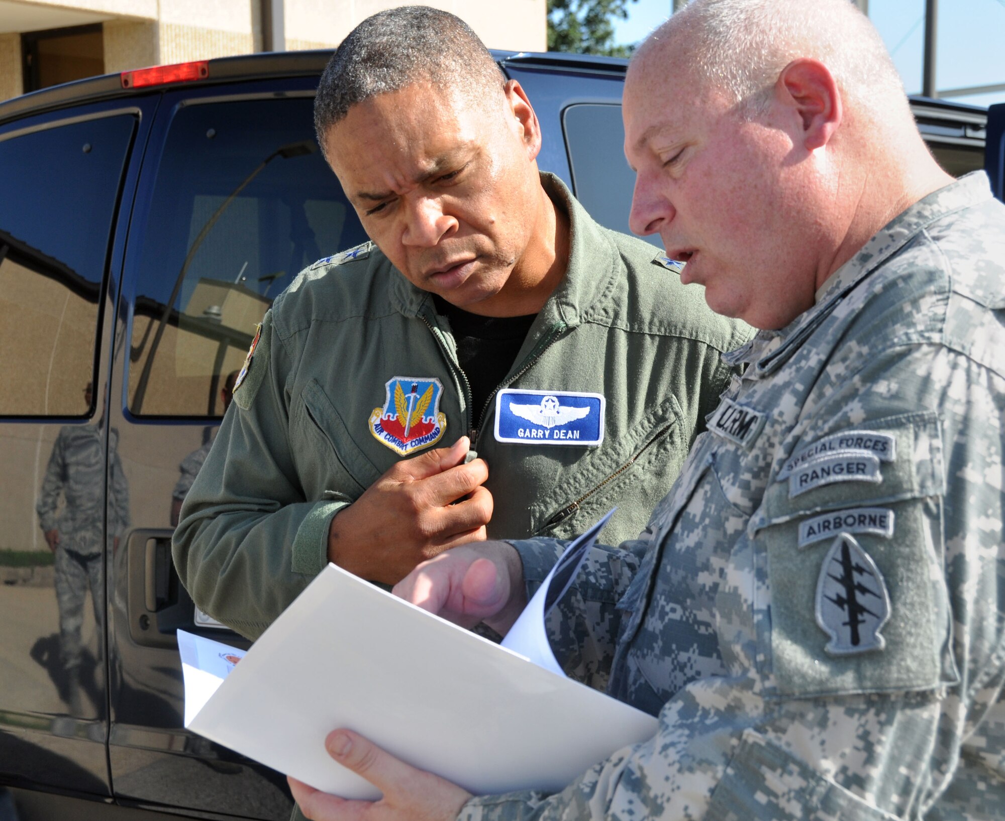Lt. Col. Don Randle, Task Force Vigilant Horizon member, gives an itinerary brief to Maj. Gen. Garry C. Dean, Air Forces Northern commander, during the general’s recent visit to the Gulf Coast.  (Mississippi Army National Guard photo by Casey Ware)