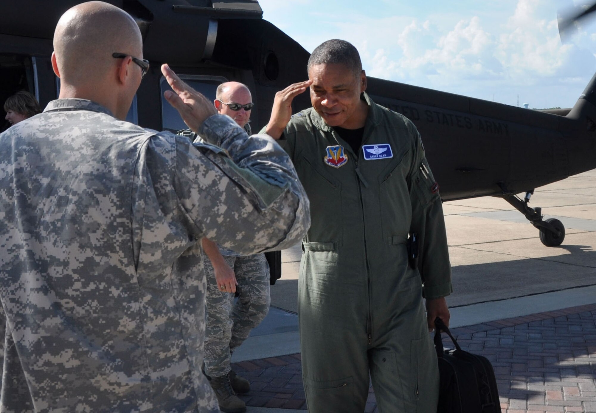 Task Force Vigilant Horizon Mayoral Cell Officer in Charge Capt. Laurence Windberry salutes Maj. Gen. Garry C. Dean, Air Forces Northern commander, upon landing at Keesler Air Force Base, Miss., during the general’s recent trip to review military air operations supporting Deepwater Horizon Response operations.  (Mississippi Army National Guard photo by Casey Ware)