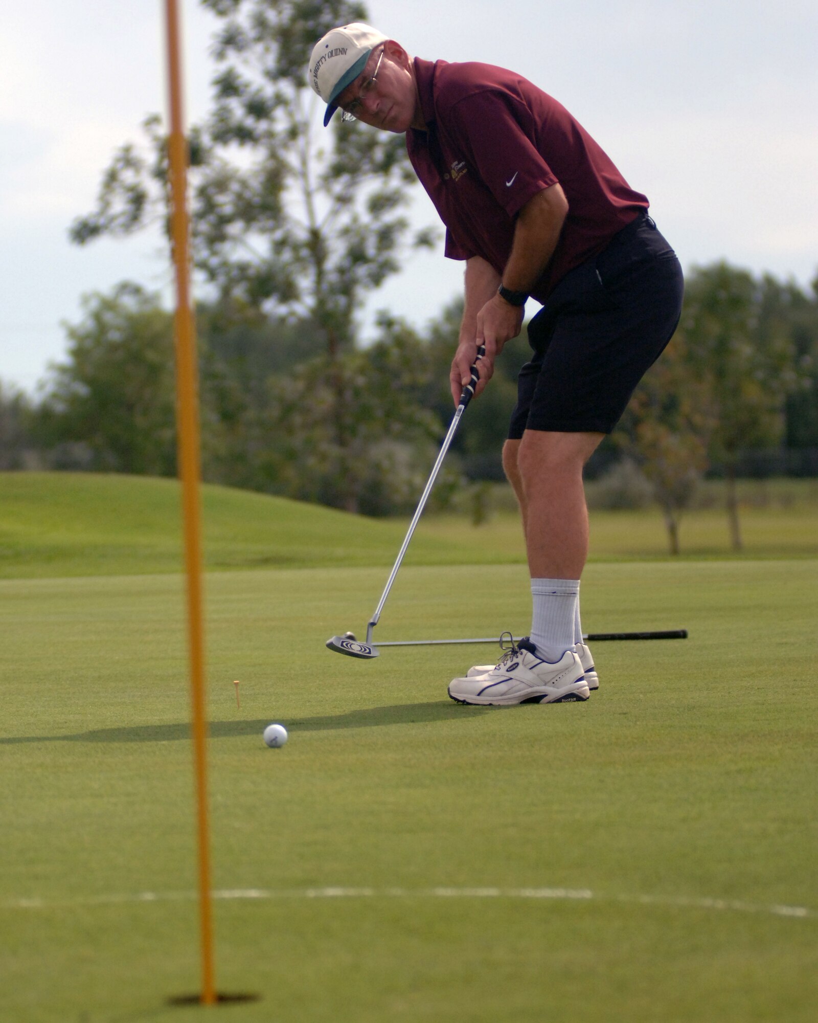 Col. John M. Quinn, 319th Air Refueling Wing vice-commander, putts a golf ball July 27 during the Airmen Against Drunk Driving Golf Tournament at the Plainsview Golf Course on Grand Forks Air Force Base, N.D. The tournament was held to raise money for AADD, which provides free, safe and confidential rides to military members, military dependents and Department of Defense civilians who need a ride after drinking. For more information on AADD, contact your unit first sergeant. (U.S. Air Force photo by Staff Sgt. R. Michael Longoria)