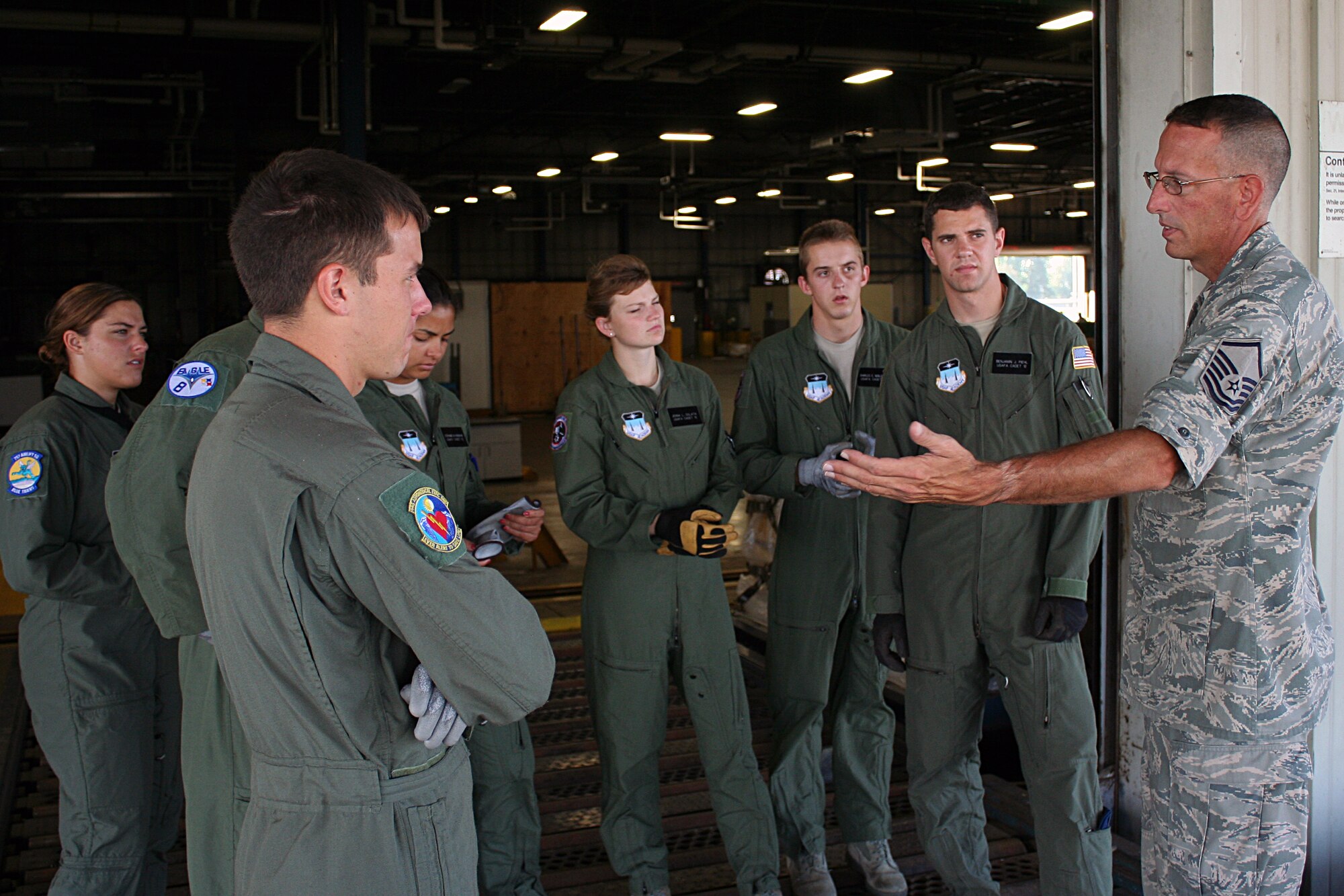 WRIGHT-PATTERSON AIR FORCE BASE, Ohio – Master Sgt. Edward Kirker, 87th Aerial Port Squadron, shows seven cadets from the Air Force Academy Cadet the day-to-day happenings of the 87 APS July 24.  The cadets were visiting the wing and the base as part of Operation Air Force, a three-week summer program through which cadets gain “real Air Force” experience during stays at Air Force bases across the country. (U.S. Air Force photo/Senior Airman Mikhail Berlin)