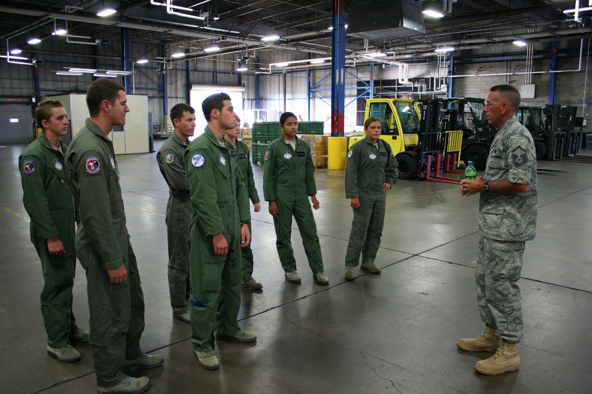 WRIGHT-PATTERSON AIR FORCE BASE, Ohio – Master Sgt. Edward Kirker, 87th Aerial Port Squadron, shows seven cadets from the Air Force Academy Cadet the day-to-day happenings of the 87 APS July 24.  The cadets were visiting the wing and the base as part of Operation Air Force, a three-week summer program through which cadets gain “real Air Force” experience during stays at Air Force bases across the country. (U.S. Air Force photo/Senior Airman Mikhail Berlin)