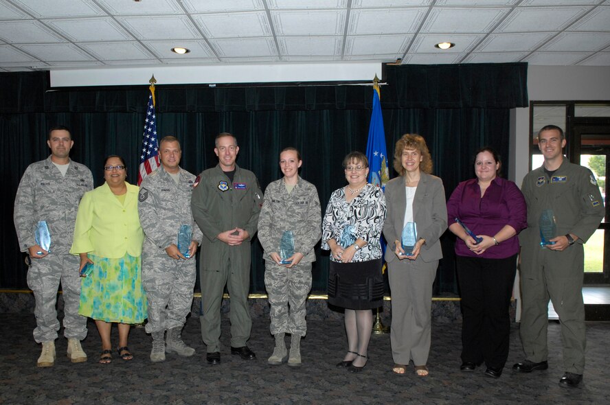 The 47th Flying Training Wing’s leadership announced the wing’s quarterly awards winners at a luncheon July 28 at Club XL. Pictured from left to right are Capt. Ian Dinesen, representing the 47th Security Forces Squadron, winner of the Squadron of the Quarter award; Susan Powell, Flight Commander of the Quarter; Master Sgt. Lyman Howard, Senior NCO of the Quarter; Col. Michael Frankel, 47th Flying Training Wing commander; Airman 1st Class Jessica Hamilton, Airman of the Quarter; Ms. Bonnie Frerich, Civilian Category III of the Quarter; Ms. Christine Engel, Civilian Category II of the Quarter; Ms. Stephanie Spears, Civilian Category I of the Quarter and Capt. Travis Patterson, Volunteer of the Quarter. Winning awards but not pictured are Tech. Sgt. William Brewer, NCO of the Quarter; Capt. Raymond Fortner, Company Grade Officer of the Quarter; Maj. David Heinitz, Field Grade Officer of the Quarter, Capt. Elliot Nelsen, Instructor Pilot of the Quarter; Airman 1st Class Ali Haynes, Room of the Quarter and 2nd Lt. Jarrod Weeks, Honor Guard Member of the Quarter. (U.S. Air Force Photo by Jose Mendoza)