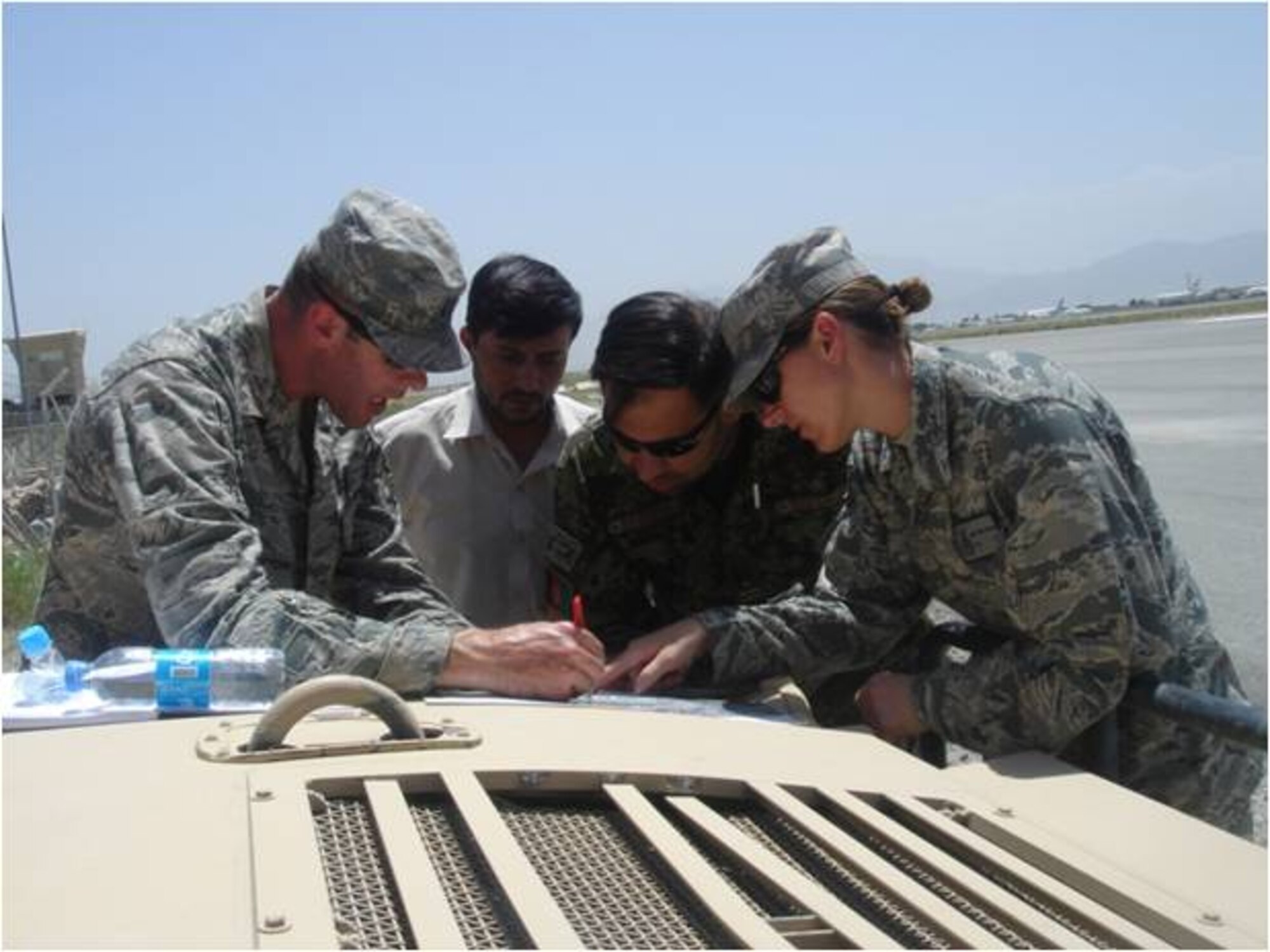 KABUL, Afghanistan - Members of the Combined Air Power Tranistion Force and Afghan Air Force Security Forces marked the unexploded ordinance and provided grid coordinate for ISAF Explosive Ordinance Disposal team . The 107mm rocket was successfully detonated in place on July 20, 2010. (U.S. Air Force photos/RELEASED).