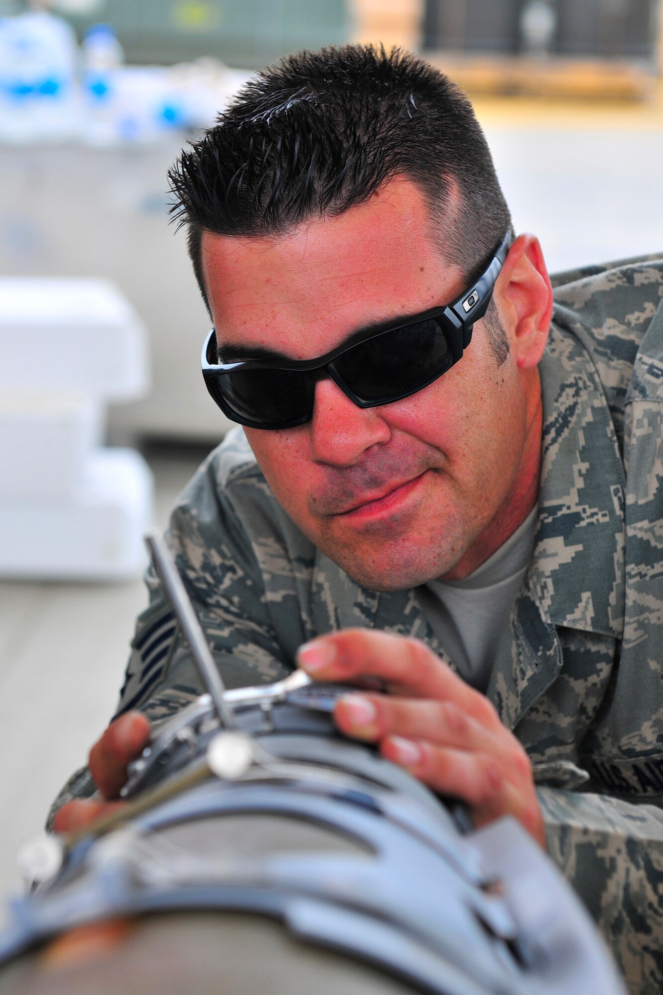 Staff Sgt. Jared Rogers, a munitions systems specialist assigned to the 455th Expeditionary Maintenance Squadron, aligns a laser target detector with the bomb body during a bomb build at Bagram Airfield, Afghanistan, July 28, 2010. The laser target detector can provide pin point accuracy and is capable of hitting moving targets. Sergeant Rogers is a native of Ocean Springs, Miss. (U.S. Air Force photo/Staff Sgt. Christopher Boitz)