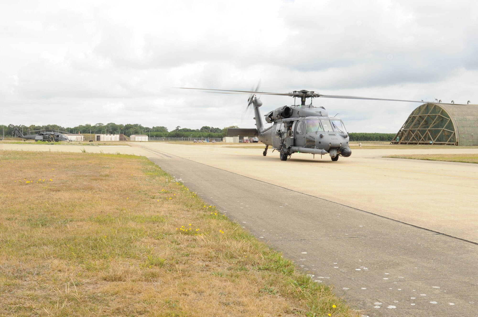 An HH-60G helicopter taxis down the runway at RAF Lakenheath, England, July 29, prior to taking off for the Allied Strike exercise in Germany. Allied Strike is a large-scale exercise providing training in tactical air control and close air support. (U.S. Air Force photo/Senior Airman David Dobrydney)