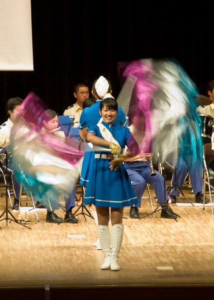 MISAWA CITY, Japan? Aomori Prefecture Headquarters Police Band and Color Guard perform in front of Misawa Air Base personnel and Misawa city officials during the annual summer traffic safety ceremony at the Misawa City civic center, July 28. Since U.S. service members make up a significant portion of the Misawa community, city officials invited base personnel to attend this event. 