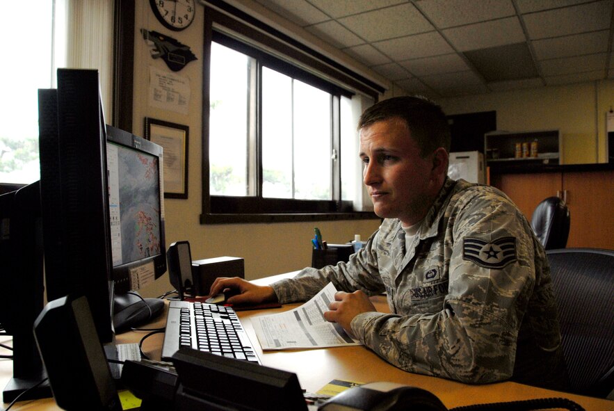 KUNSAN AIR BASE, Republic of Korea -- Staff Sgt. Dustin Mimnaugh, 8th Operations Support Squadron weather forecaster, keeps an eye on the weather here July 28 for pilots supporting the Republic of Korea-U.S. joint naval exercise Invincible Spirit. Members of the 35th and 80th Fighter Squadrons here flew 20 total sorties in support of the exercise. (U.S. Air Force photo/Staff Sgt. Amanda Savannah)