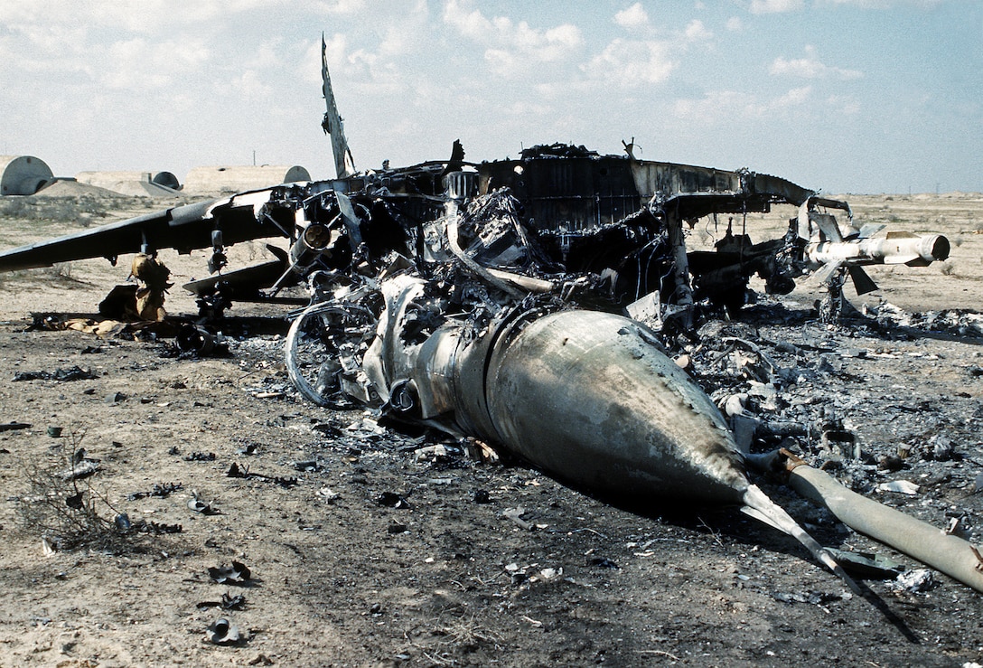 An Iraqi MiG-29 (NATO: Fulcrum) aircraft lies in ruins after it was destroyed by Allied forces during Operation Desert Storm.