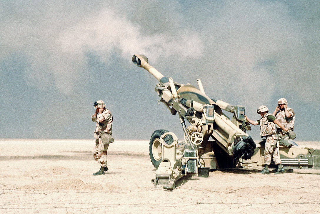 Marine artillerymen from the 2nd Marine Expeditionary Force fire their M-198 155mm howitzer in support of the opening of the ground offensive to free Kuwait during Operation Desert Storm.